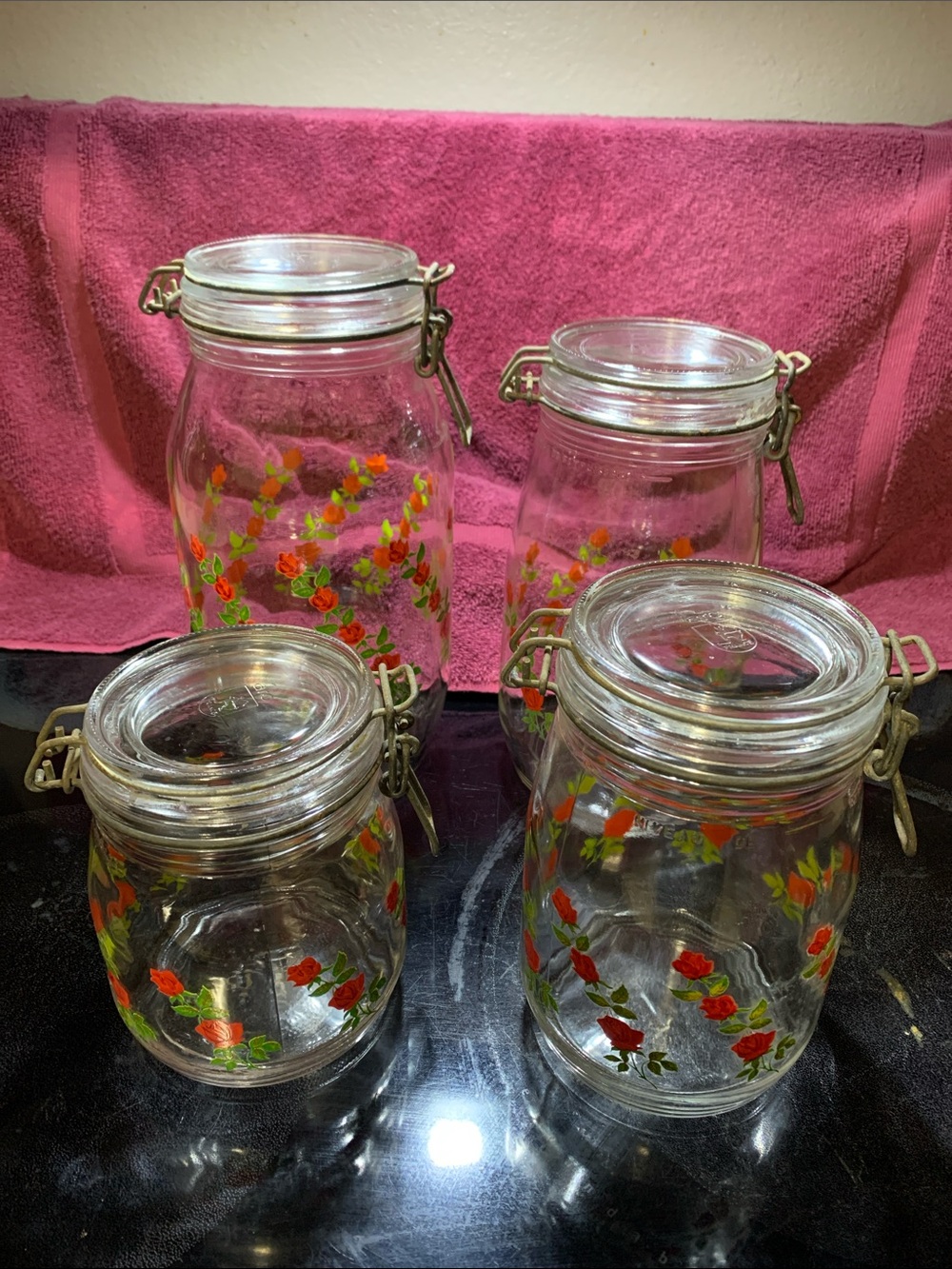 Set of 4 Glass Canisters with Red Rose Motif